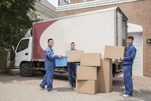 Team member using safe lifting techniques during a move