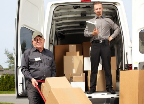 Professional Camdentown man and van team loading furniture carefully