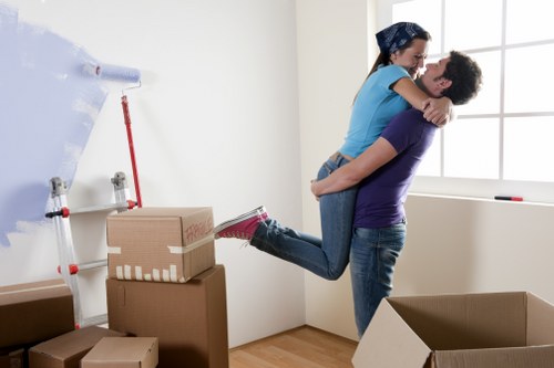 Camdentown house removalists carefully carrying a sofa during a home move