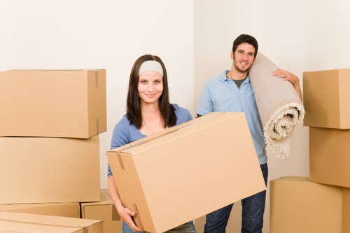 Mover wearing PPE while handling furniture