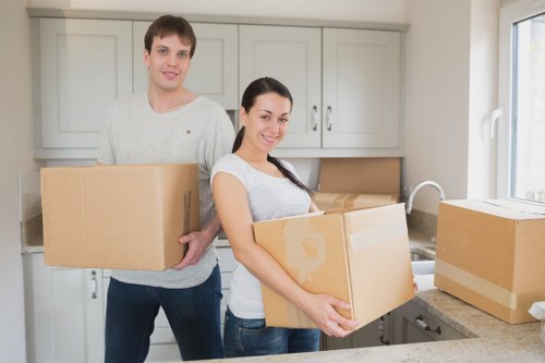 Team carefully carrying furniture through a property